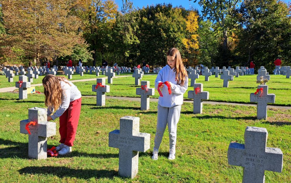 St. Greg students decorate cemetary