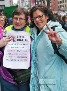 two sisters at women's march in nyc