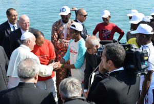 pope francis greets migrants