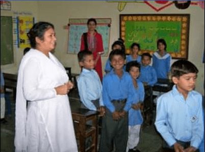 Sister Catherine Bashir visiting a classroom